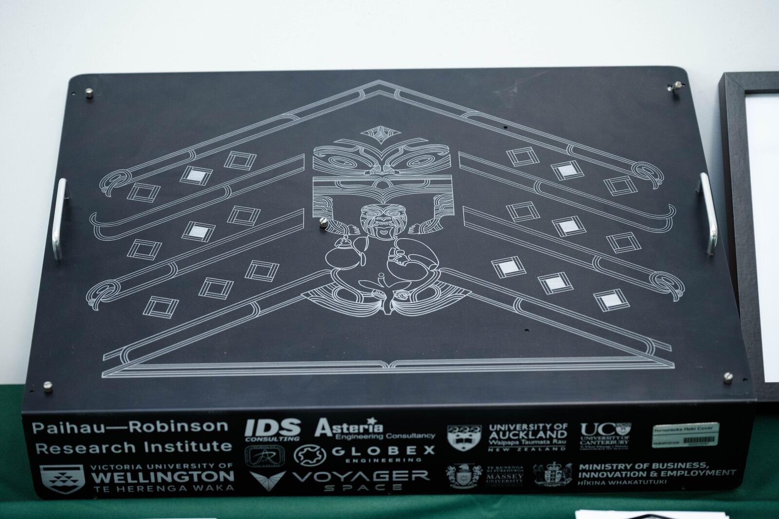 Payload cover featuring Māori artwork.